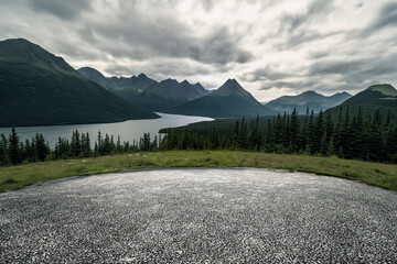 The open asphalt ground is set against the backdrop of mountains