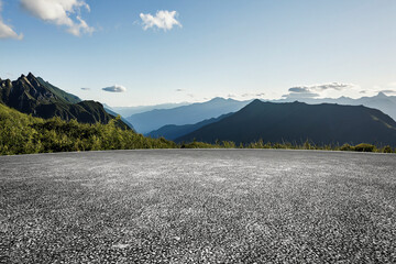 The open asphalt ground is set against the backdrop of mountains
