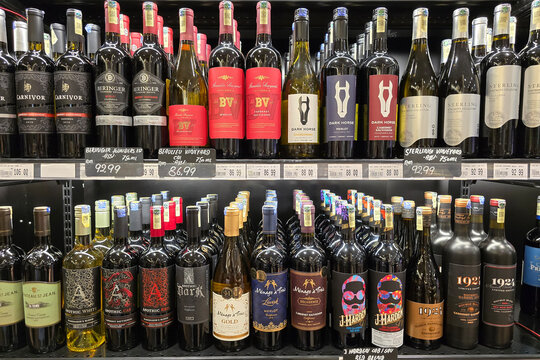 Penang, Malaysia &ndash; May 25, 2025: A shelf filled with a variety of wine bottles in a grocery, popular brands like Dark Horse, Beringer, Apothic, Sterling Vineyards, Menage &agrave; Trois and J. Harden.