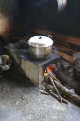 Old-world kitchen. Earthen stove, wood smoke – a glimpse into traditional culinary methods