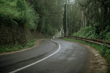 Winding Road Through a Misty Mountain Landscape