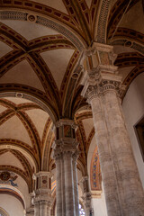 The elegant Renaissance facade of the Cathedral of Pienza, also known as Duomo di Santa Maria...
