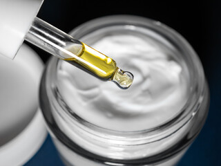 Add drops to anti-wrinkle face cream, hyaluronic acid, extract