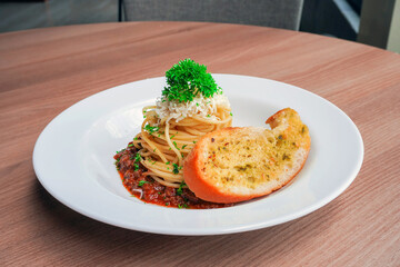 Classic spaghetti bolognese with rich sauce and crispy garlic bread. Perfect for Italian cuisine, comfort food, and recipe visuals