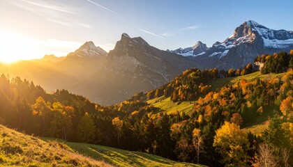 Sunrise over a mountainous landscape with autumn trees and clear skies.