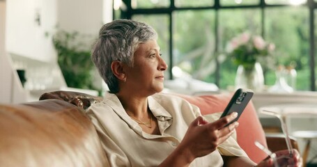 Senior, woman and phone with disappointment on sofa for bad news or annoyed emotion in home. Mature, female person or upset with mobile smartphone app for irritation or mood swings in menopause - Powered by Adobe