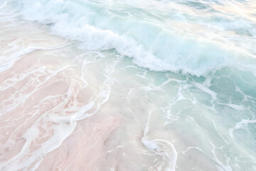 Serene ocean waves gently caress a pristine pink sand beach creating a breathtaking coastal scene of tranquility and natural beauty.