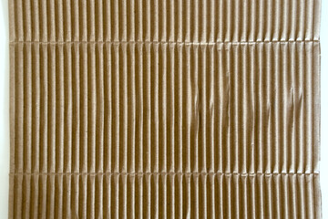 Corrugated brown packaging cardboard paper on white table. Abstract background