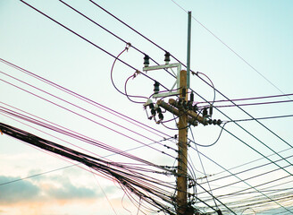 Electric pole with wires on bright background. Close up photo. Electric pole with wires under sky....