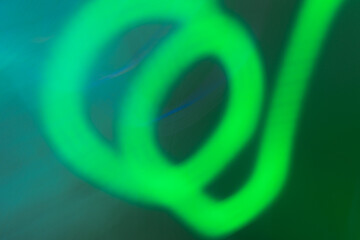 Vibrant abstract shapes dance in colorful light display during nighttime event