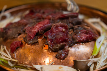 roasting seasoned beef on the grill
