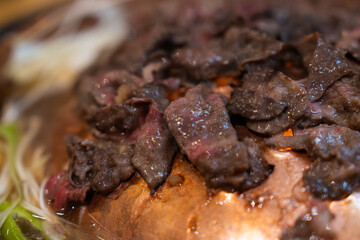 roasting seasoned beef on the grill