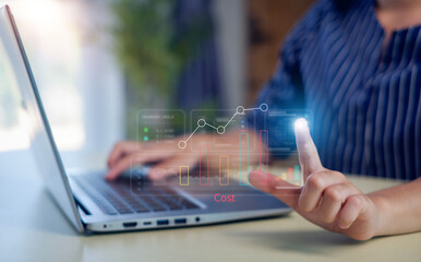 Business pointing down arrow of the graph with cost reduction business finance on virtual screen. Cost reduction concept.