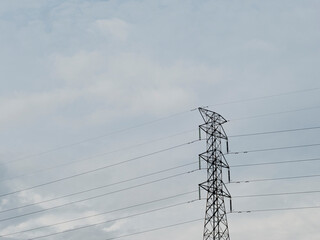 Cellular Base Station Tower. A base station equipped with 4G and 5G cellular wireless communication technology with a mobile phone with a clear sky background with copy space.