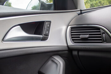 interior of a modern car, black panel door 