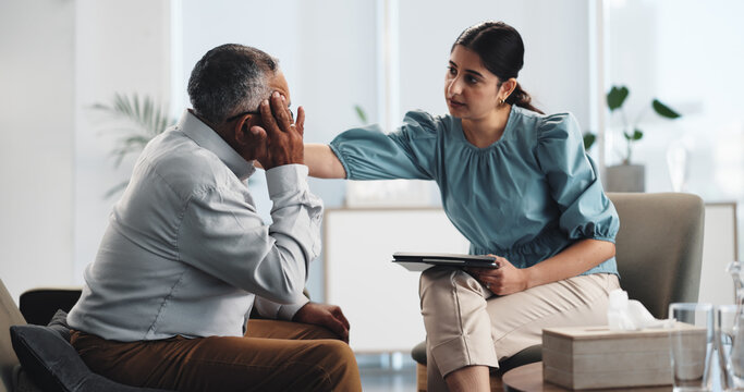 Office, psychologist and comfort for man, mental health or empathy for elderly patient with anxiety. Counselling, senior client and woman with kindness for old person, communication and appointment