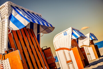 Beachside cabins lined on a sunny day showcasing vibrant colors and clear skies in a coastal location