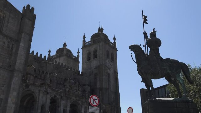 Pan Shot of Porto Cathedral and V&iacute;mara Peres Statue, Portugal,Smooth pan shot recorded with professional camera showing the iconic S&eacute; do Porto (Porto Cathedral)GPS: 41.1429&deg; N, 8.6110&deg; W