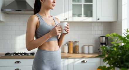 Fit Woman Enjoying Morning Coffee in Bright Kitchen