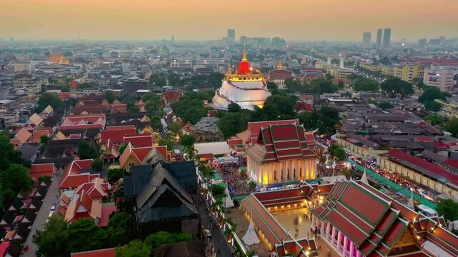 Aerial View of Bangkok Cityscape at Dusk with Wat Saket Temple