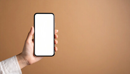Hand holding smartphone with blank white screen on plain brown background, perfect for digital display or app presentation with calm and neutral tone