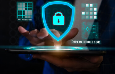 Cybersecurity expert demonstrating secure data protection techniques on a tablet in a modern office setting with digital visualizations