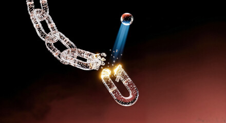 Laser beam breaking glass chain on dark background