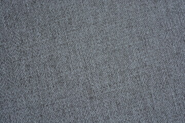 Things, objects, fabric backgrounds. Beautiful dense gray quality fabric with dark inclusions.