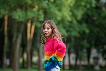 Obraz premium Portrait of young beautiful long-haired girl outdoors in summer.