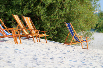 Deckchairs at white sandy beach, summer scene (IJsselmeer, Frisia, Netherlands)