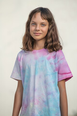 Portrait of young beautiful long-haired girl outdoors in summer.