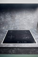 Flat cooktop cooking induction electric built black stove. Grey countertop with black glossy built...