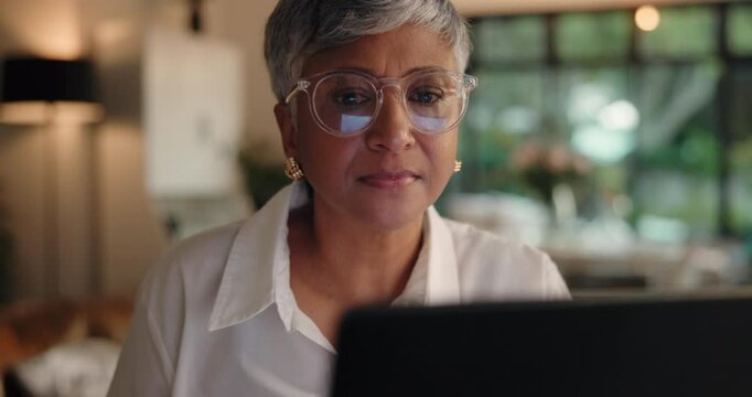 Remote work, mature woman and laptop in home for editing draft, reading editor feedback or research. Creative project, author and tech for publishing review, proofreading script and planning article