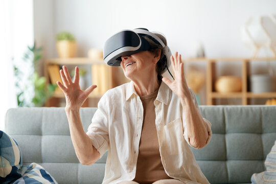 woman playing console games wearing vr goggles - Powered by Adobe