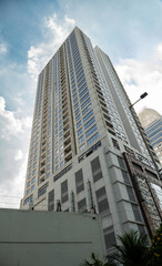 Obraz premium Architectural design of an office building in Jakarta. Photographed during the daytime sunny blue sky cloudy weather. 