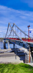 Parkovy Pedestrian Bridge over the Dnieper (Dnipro) River and Trukhanov Island. Road with cars. Ukraine Kiev (Kyiv). Europe