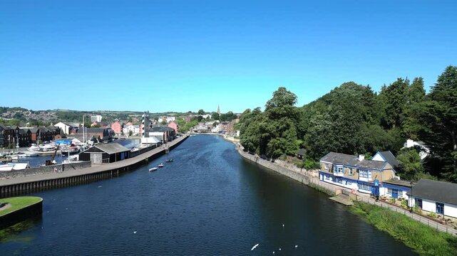 Exeter, Devon, England: DRONE VIEWS: Heading northwards low over the River Exe and onwards to the Quays. Exeter is a popular UK travel destination.