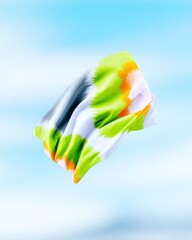 Vibrant Green Orange White Silk Flag Flowing in the Sky