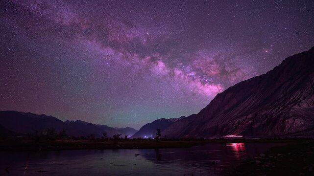 Time lapse The Milky Way stands perpendicular to the summit of Himalayan. Clouds followed by, obscuring the sky and stars. The night sky sparkles with stars. wonderful and mesmerizing picture.