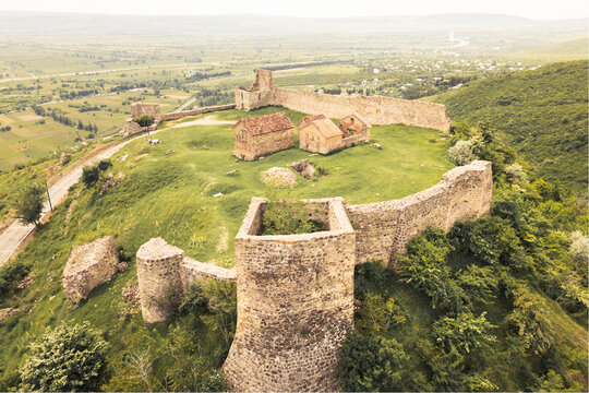 Aerial view Manavi Fortress Complex. A Medieval Royal Stronghold. Strategic Hilltop Citadel Overlooking Iori Valley in Kakheti, Georgia. Hidden gem sightseeing off the beaten path attraction