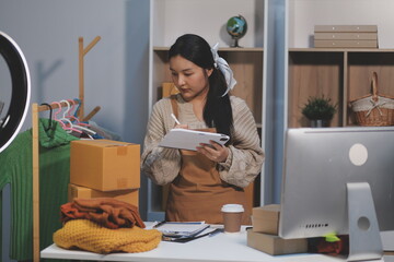Young asian women happy after new order from customer. Surprise and shock face of asian woman success on making big sale of his online store. Online Selling. Online Shopping
