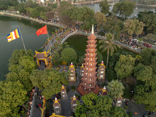 Exploring Tran Quoc temple in Hanoi amidst vibrant surroundings and historical architecture in Vietnam