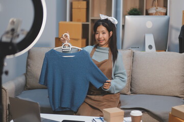 Young asian women happy after new order from customer. Surprise and shock face of asian woman success on making big sale of his online store. Online Selling. Online Shopping