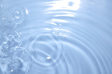 Calm Water Surface with Gentle Ripples and Bubbles Formations