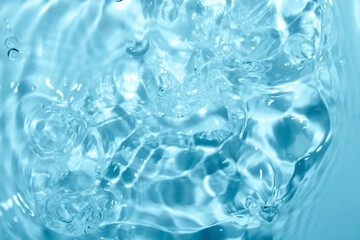 Crystal Clear Blue Water Ripples and Bubbles in Calm Surface