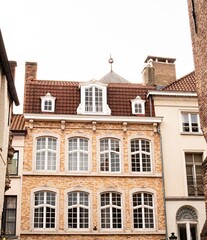 Old European architecture, Belgium Bruges houses with dormer windows – perfect for European city...