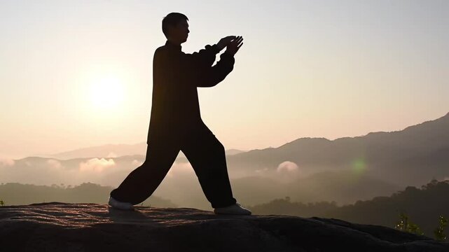 silhouette of a man practicing Tai chi