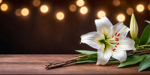 Fototapeta premium White Easter Lily with Crown of Thorns on Wooden Table