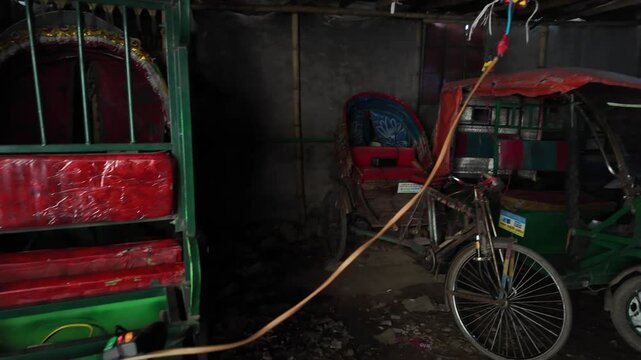 Electric rickshaw charging, Dhaka Division, Dhaka, Bangladesh