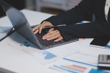 Fototapeta premium Audit concept,Administrator business man financial inspector and secretary making report calculating balance. Internal Revenue Service checking document.
